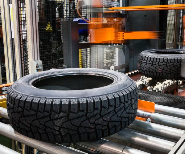 A tire on a conveyor belt