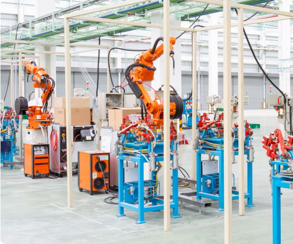 A group of robotic arms in a factory